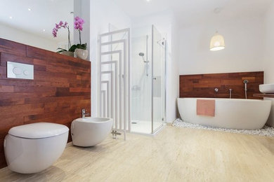 Mid-sized master light wood floor bathroom photo in Austin with a vessel sink, a bidet and white walls
