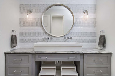 Example of a mid-sized transitional kids' gray tile and porcelain tile single-sink bathroom design in Orlando with shaker cabinets, gray cabinets, white walls, a trough sink, quartzite countertops, gray countertops and a built-in vanity