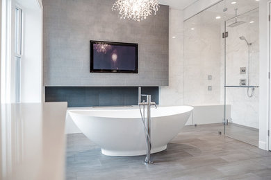 Bathroom - large contemporary master beige tile, gray tile and porcelain tile porcelain tile bathroom idea in Chicago with recessed-panel cabinets, white cabinets, a two-piece toilet, white walls, an undermount sink and quartz countertops