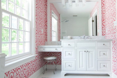 Example of a mid-sized classic kids' white tile and subway tile porcelain tile bathroom design in Other with beaded inset cabinets, white cabinets, a two-piece toilet, pink walls, an undermount sink and marble countertops