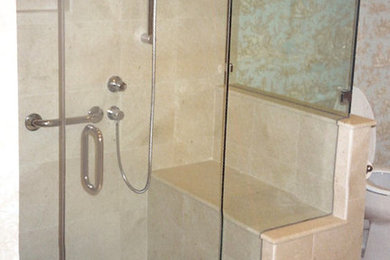 Inspiration for a beige tile and ceramic tile ceramic tile corner shower remodel in Baltimore with a pedestal sink, medium tone wood cabinets, granite countertops, a two-piece toilet and beige walls