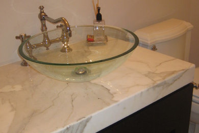 Example of a small transitional marble floor bathroom design in Miami with a vessel sink, open cabinets, white cabinets and marble countertops