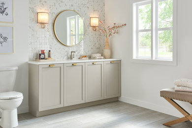Large trendy master porcelain tile and beige floor bathroom photo in New York with recessed-panel cabinets, beige cabinets, a two-piece toilet, white walls, an undermount sink, quartz countertops and white countertops