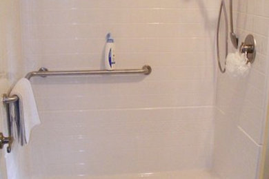 Example of a white tile walk-in shower design in Richmond
