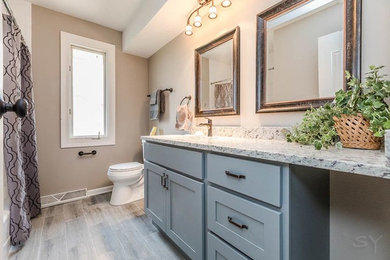 Inspiration for a bathroom remodel in Chicago with shaker cabinets and gray cabinets