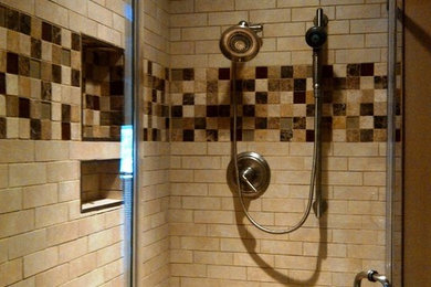 Mid-sized transitional 3/4 porcelain tile corner shower photo in Other with beige walls, a vessel sink and solid surface countertops
