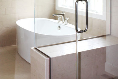 Bathroom - mid-sized contemporary master beige tile and porcelain tile porcelain tile bathroom idea in Cedar Rapids with light wood cabinets, beige walls and a hinged shower door