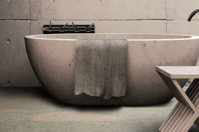 Réalisation d'une salle de bain design avec un carrelage beige, un carrelage de pierre et une baignoire indépendante.