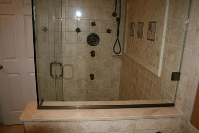 Sauna - beige tile marble floor sauna idea in New York with a console sink