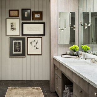 Example of a trendy master bathroom design in New York with flat-panel cabinets, white walls and an undermount sink