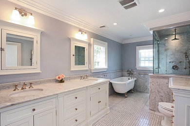 Large traditional ensuite bathroom in New York with shaker cabinets, white cabinets, marble worktops, white tiles, grey tiles, a claw-foot bath, a corner shower, a two-piece toilet, a submerged sink, marble tiles, grey walls, mosaic tile flooring, grey floors and a hinged door.