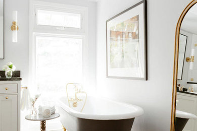 Inspiration for a transitional master brown floor claw-foot bathtub remodel in New York with gray walls, flat-panel cabinets and white cabinets