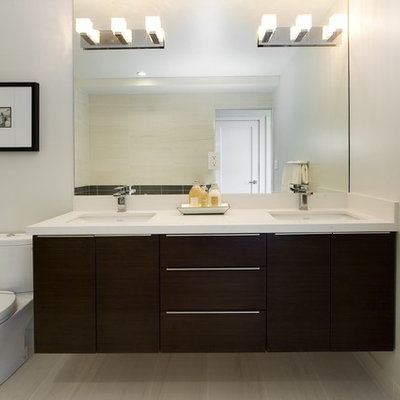 Inspiration for a contemporary beige tile bathroom remodel in Other with an undermount sink, flat-panel cabinets and dark wood cabinets