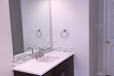 Bathroom - mid-sized modern master bathroom idea in Dallas with dark wood cabinets, an undermount sink and quartz countertops