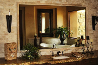 Bathroom - large traditional master multicolored tile and ceramic tile ceramic tile bathroom idea in Phoenix with a drop-in sink, raised-panel cabinets, dark wood cabinets, granite countertops, a one-piece toilet and beige walls