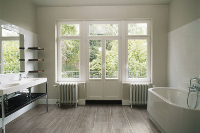 Freestanding bathtub - modern master vinyl floor freestanding bathtub idea in Atlanta with white walls