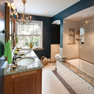 Elegant beige tile and subway tile alcove bathtub photo in Milwaukee with an undermount sink