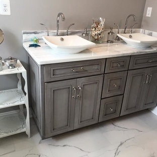 Bathroom - mid-sized contemporary 3/4 marble floor bathroom idea in New York with shaker cabinets, gray cabinets, gray walls, a vessel sink and marble countertops