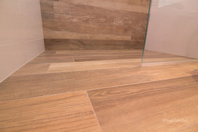 Small trendy kids' porcelain tile walk-in shower photo in Montreal with an integrated sink, flat-panel cabinets, light wood cabinets, a one-piece toilet and white walls