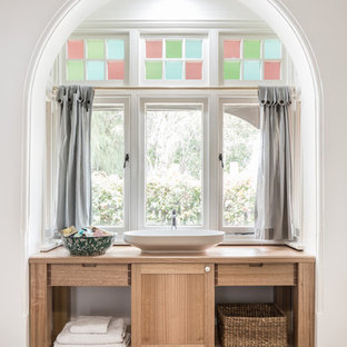 Transitional bathroom in Sydney with shaker cabinets, medium wood cabinets, white walls, a vessel sink, wood benchtops, brown floor and brown benchtops.