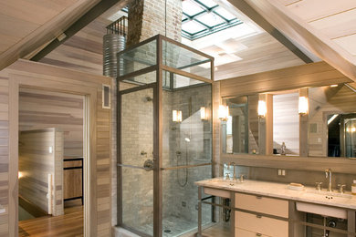 This is an example of a contemporary shower room bathroom in Austin with flat-panel cabinets, a submerged sink, a corner shower, grey tiles, medium hardwood flooring and white cabinets.