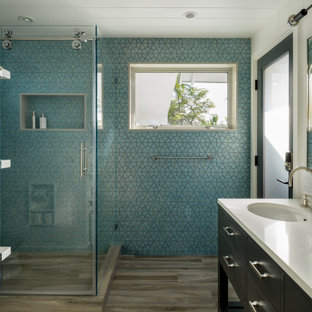 Mid-sized beach style blue tile and ceramic tile porcelain tile, gray floor, single-sink, shiplap ceiling and wall paneling bathroom photo in Hawaii with flat-panel cabinets, gray cabinets, a one-piece toilet, blue walls, an undermount sink, quartz countertops, white countertops and a freestanding vanity