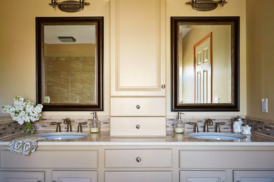 Mid-sized transitional master beige tile ceramic tile bathroom photo in Other with an undermount sink, shaker cabinets, light wood cabinets, quartz countertops, a one-piece toilet and beige walls