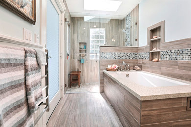 Example of a large beach style master brown tile and porcelain tile porcelain tile and brown floor walk-in shower design in San Francisco with shaker cabinets, white cabinets, an undermount tub, blue walls, an undermount sink, terrazzo countertops, a hinged shower door and white countertops