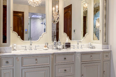 Example of a large ornate master gray tile and stone tile marble floor bathroom design in Chicago with beaded inset cabinets, a two-piece toilet, white walls, an undermount sink, marble countertops and gray cabinets