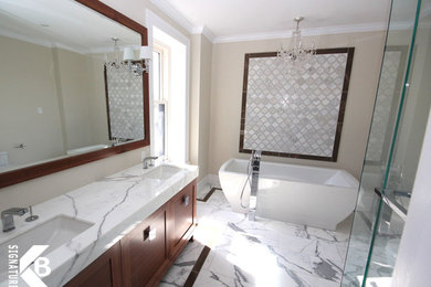 Bathroom - mid-sized contemporary master white tile and stone tile marble floor bathroom idea in Montreal with an undermount sink, shaker cabinets, medium tone wood cabinets, marble countertops, a one-piece toilet and beige walls