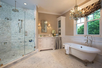 Example of a large classic master stone slab and multicolored tile marble floor, white floor and single-sink bathroom design in Tampa with recessed-panel cabinets, white cabinets, a one-piece toilet, beige walls, an undermount sink, marble countertops, a hinged shower door, white countertops and a built-in vanity