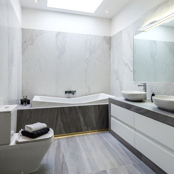 Beautiful, bright bathroom featuring large format marble-effect tiles