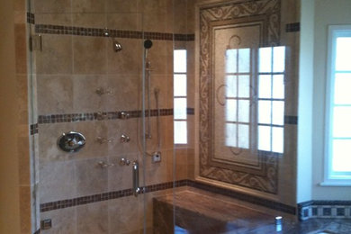 Corner shower - large mediterranean master beige tile, brown tile, multicolored tile and mosaic tile ceramic tile corner shower idea in Los Angeles with an undermount tub, beige walls and granite countertops