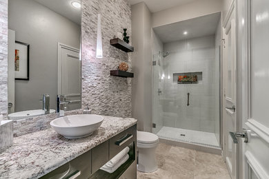 Alcove shower - mid-sized contemporary 3/4 white tile ceramic tile and beige floor alcove shower idea in Oklahoma City with gray walls, a vessel sink, granite countertops, a hinged shower door, flat-panel cabinets and black cabinets
