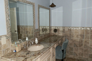 Example of a classic master bathroom design in New York with blue walls