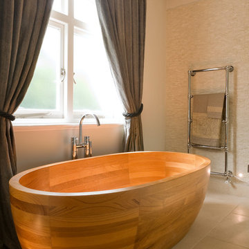 Beautiful wooden bath in this spacious bathroom