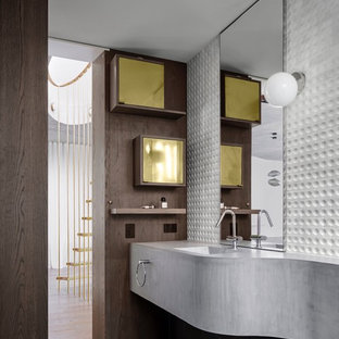This is an example of a contemporary bathroom in Sydney with gray tile, white tile, white walls, an integrated sink, concrete benchtops, grey floor and grey benchtops.