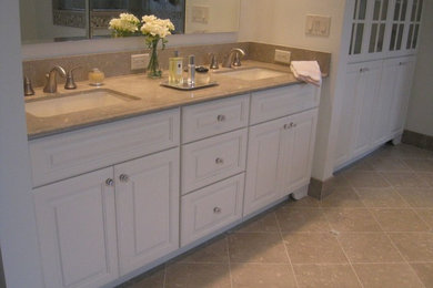 Bathroom - large traditional master beige tile and stone tile travertine floor bathroom idea in New York with raised-panel cabinets, white cabinets, limestone countertops, beige walls and an undermount sink