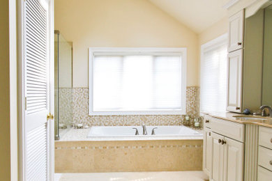 Bathroom - large eclectic master multicolored tile and mosaic tile porcelain tile and beige floor bathroom idea in Philadelphia with beaded inset cabinets, white cabinets, a two-piece toilet, beige walls, an undermount sink, granite countertops, a hinged shower door and beige countertops
