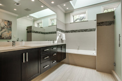 Mid-sized transitional master beige tile and porcelain tile porcelain tile bathroom photo in Dallas with an undermount sink, shaker cabinets, dark wood cabinets, quartz countertops, a two-piece toilet and blue walls
