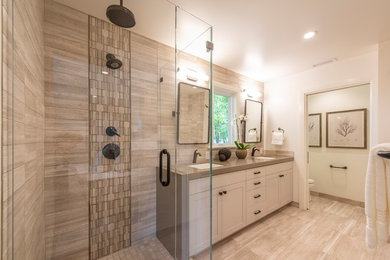 Example of a large transitional master brown tile and marble tile marble floor and brown floor corner shower design in San Francisco with shaker cabinets, white cabinets, an undermount tub, a two-piece toilet, white walls, an undermount sink, quartz countertops, a hinged shower door and brown countertops
