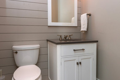 Example of a small transitional 3/4 bathroom design in Other with shaker cabinets, white cabinets, a two-piece toilet, beige walls and an undermount sink