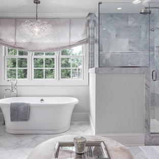 Example of a large transitional master gray tile and marble tile marble floor and gray floor bathroom design in Nashville with gray walls and a hinged shower door