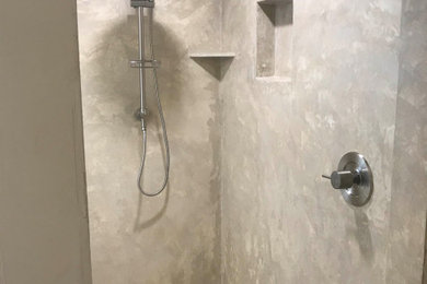 Alcove shower - mid-sized mediterranean master alcove shower idea in Tampa with a hinged shower door