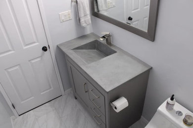 Inspiration for a mid-sized modern bathroom remodel in Seattle with concrete countertops and gray countertops