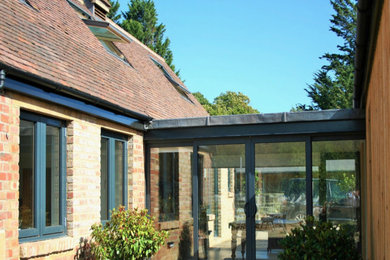 Photo of a contemporary house exterior in Sussex.