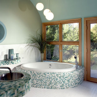 Design ideas for a contemporary bathroom in Milwaukee with a drop-in sink, tile benchtops, a drop-in tub, multi-coloured tile, mosaic tile and turquoise benchtops.