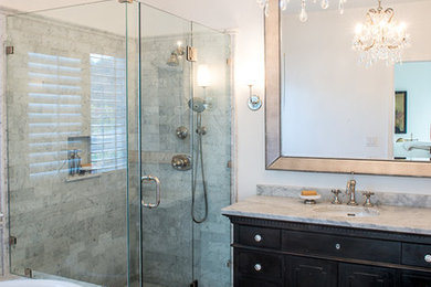 Bathroom - mid-sized contemporary 3/4 gray tile and marble tile marble floor and gray floor bathroom idea in San Francisco with raised-panel cabinets, dark wood cabinets, white walls, an undermount sink, marble countertops and a hinged shower door
