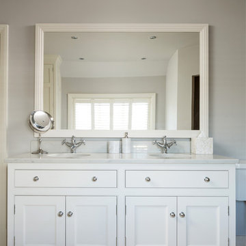 Bespoke bathroom vanity unit with undermount sinks and quartz top