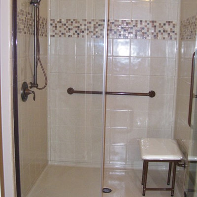 Walk-in shower photo with a hinged shower door